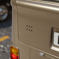 Beige car with MG logo on a blurred background